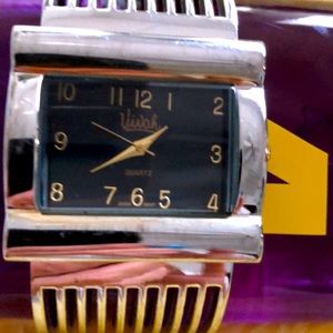 Ladies Viva vintage quartz stainless steel back, silvertone? Water resistant.